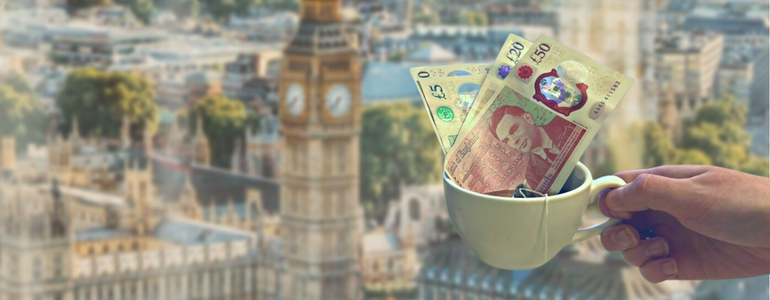 New 50 pound GBP note being dipped into a cup of tea