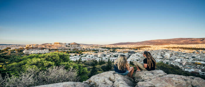 2 people on rock in Athens