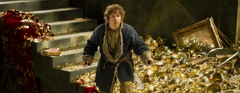 Film still from The Hobbit: Bilbo Baggins among treasure.