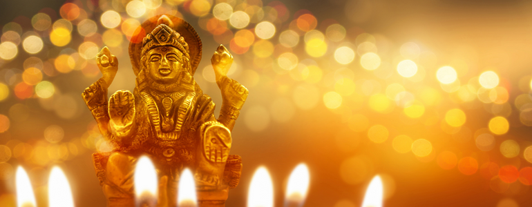 Hindu Goddess Lakshmi with traditional lamps and candles