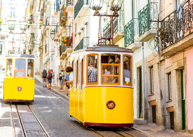 Traditional bright yellow tram in Lisbon, Portugal.