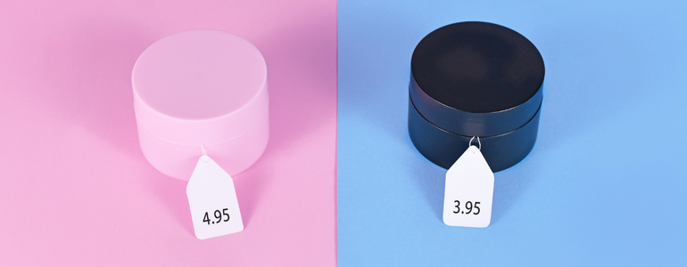 The image is split into one side being pink (representing women), and the other blue (to represent men). The same item (a round block) is on both sides, but on the women's side it's $1 more expensive.