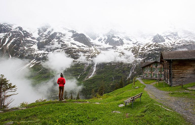 Girl overlooks mountains in Switzerland