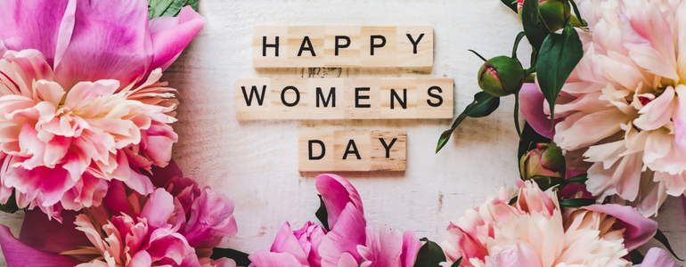 International Women's Day image created with flowers and tiled letters. It reads "Happy Women's Day!"