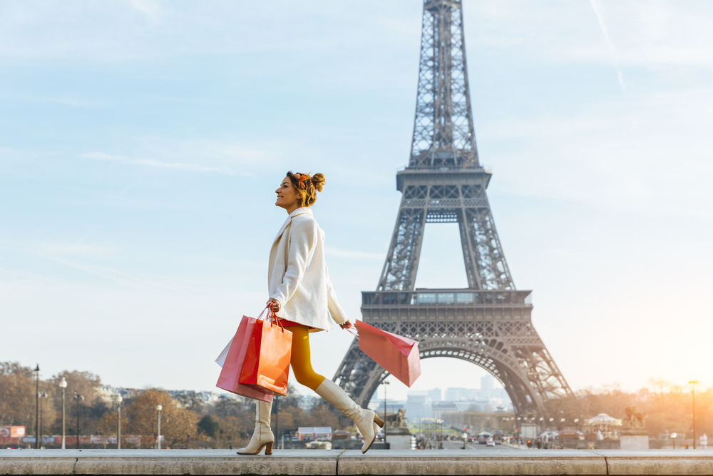 Girl shopping in front of Eiffel tower
