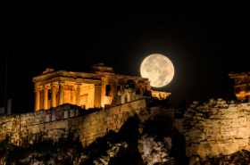 Where to travel based on your star sign. Astrophotography of moon and stars against the ancient Acropolis in Athens, Greece
