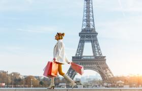 Girl shopping in front of Eiffel tower